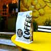 a bag of coffee on a yellow table