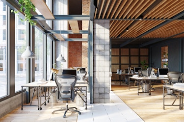 Open office space with big windows and lots of light.